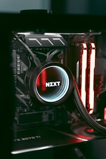 a close up of a computer with a red light