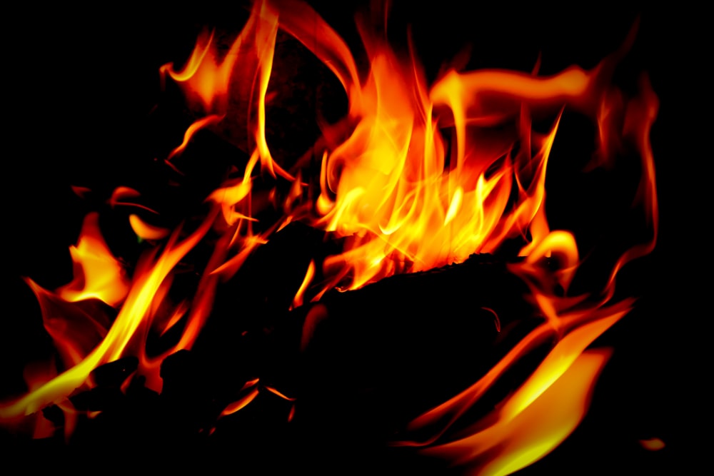 a close up of a fire in the dark