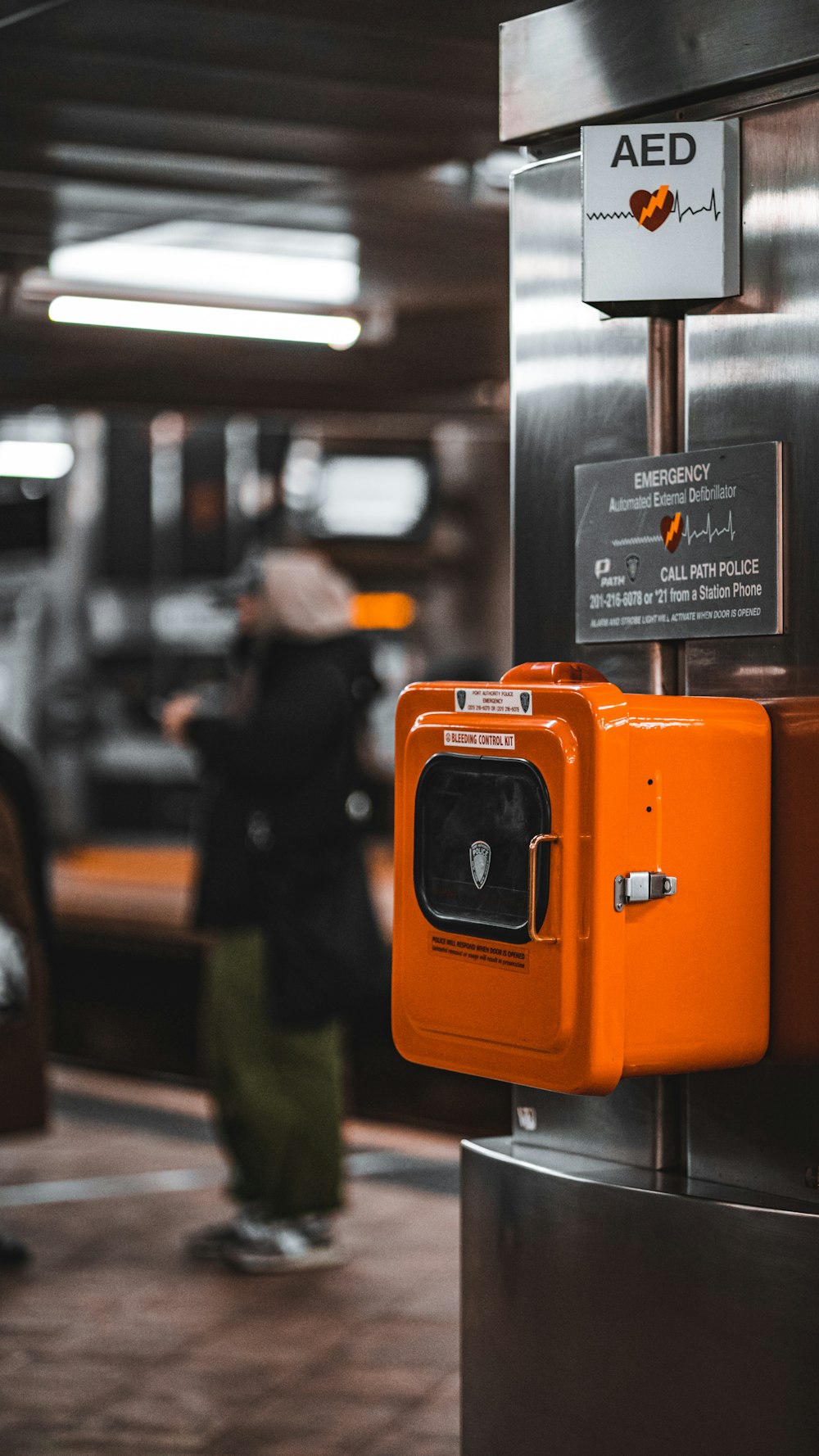 a parking meter with an orange cover on it