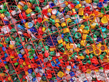 a large amount of plastic bottles in a cage