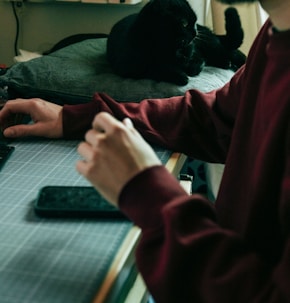 a man sitting at a desk with a laptop computer