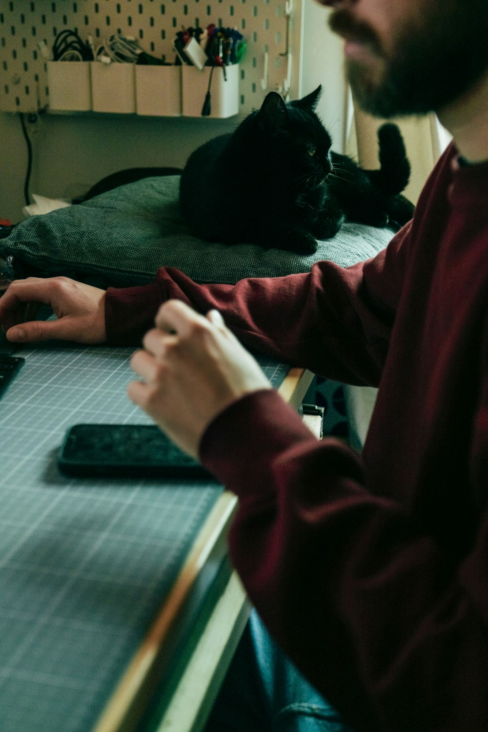 a man sitting at a desk with a laptop computer