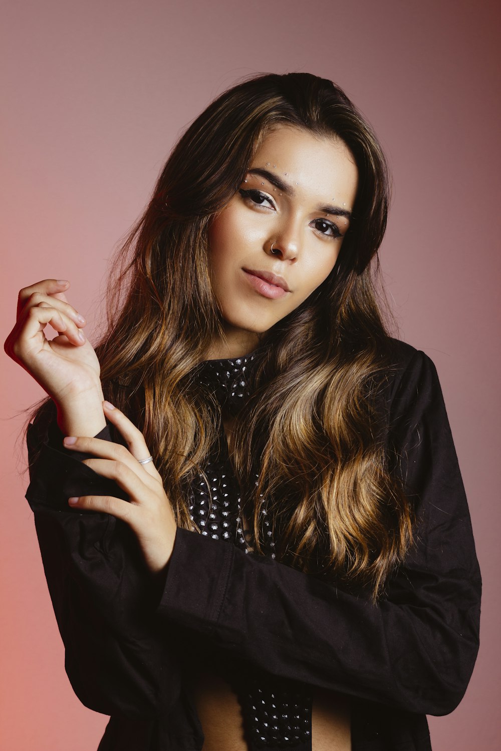 a woman with long hair posing for a picture