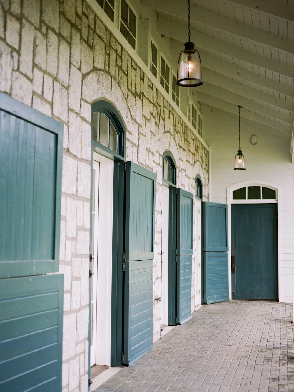 a row of blue and white doors on a building