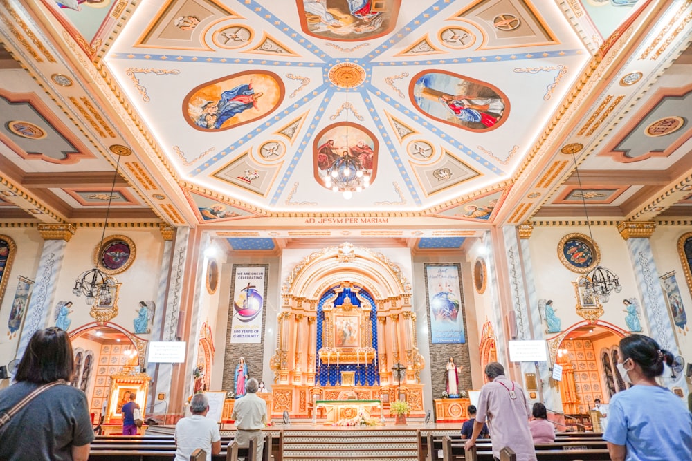 a group of people standing inside of a church