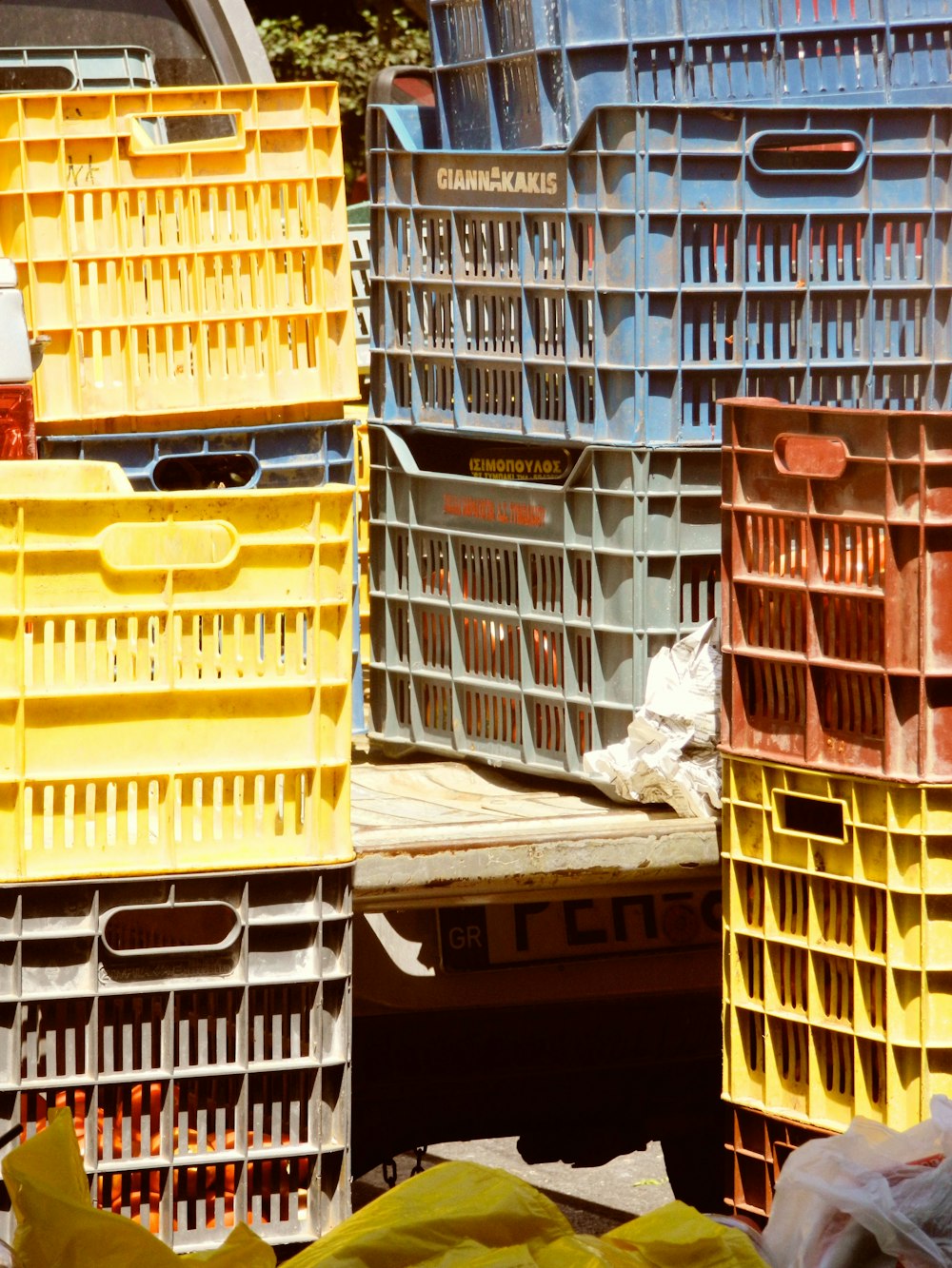 a pile of yellow and red crates sitting next to each other