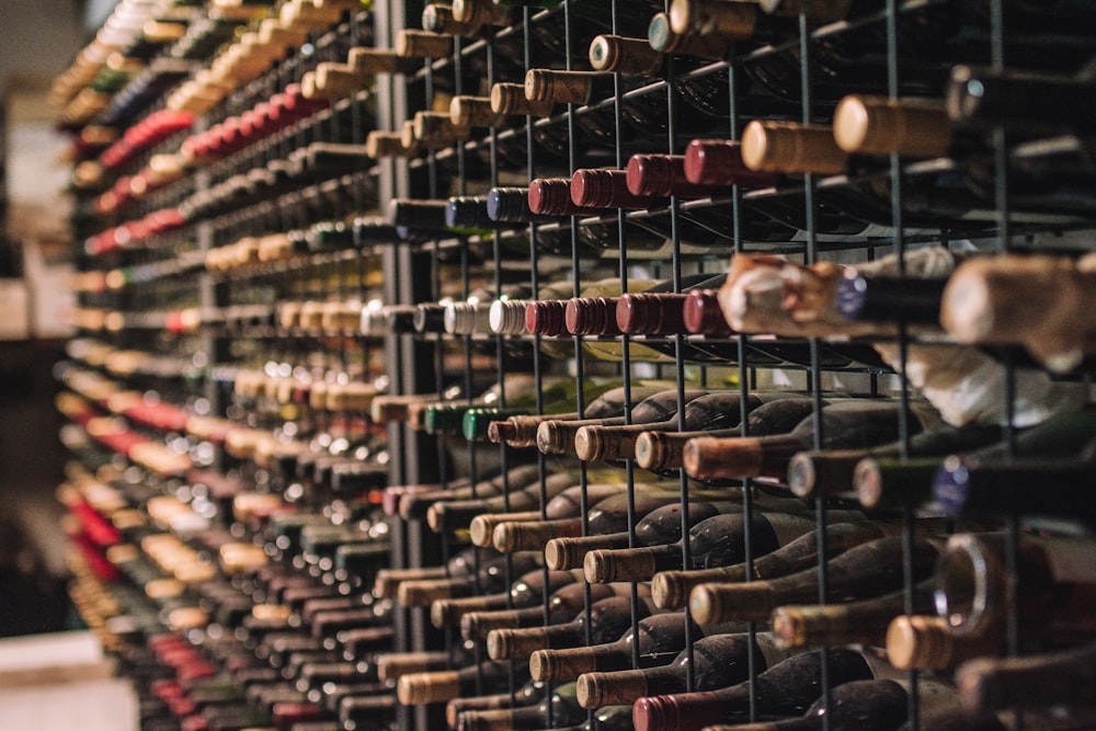 a wine rack filled with lots of bottles of wine