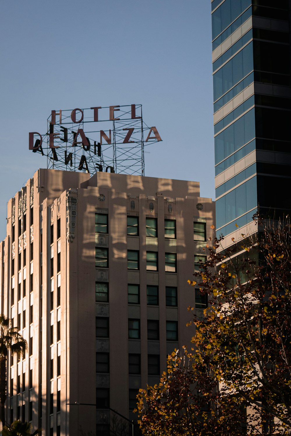 a hotel sign on top of a building