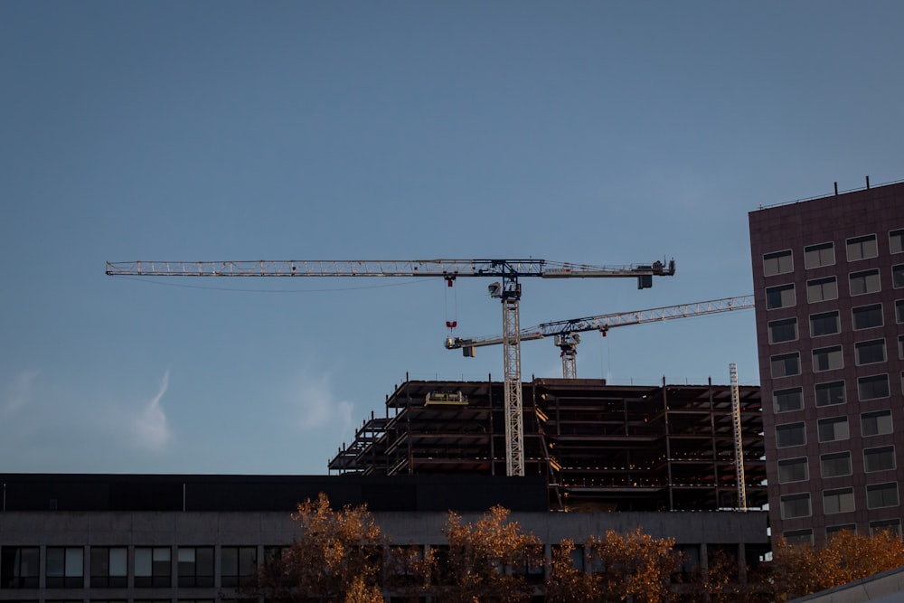 a crane is on top of a building under construction