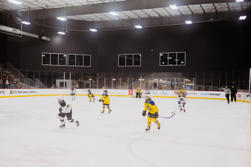 a group of young men playing a game of ice hockey