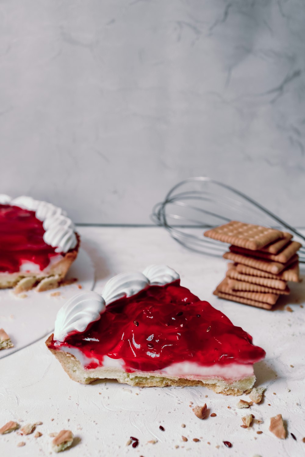 a slice of cheesecake with a strawberry topping