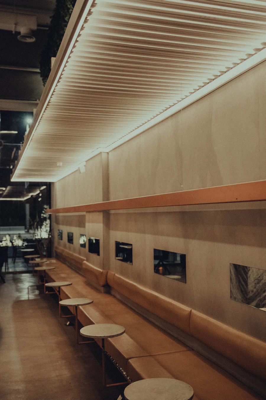 A row of benches beside a long shared table