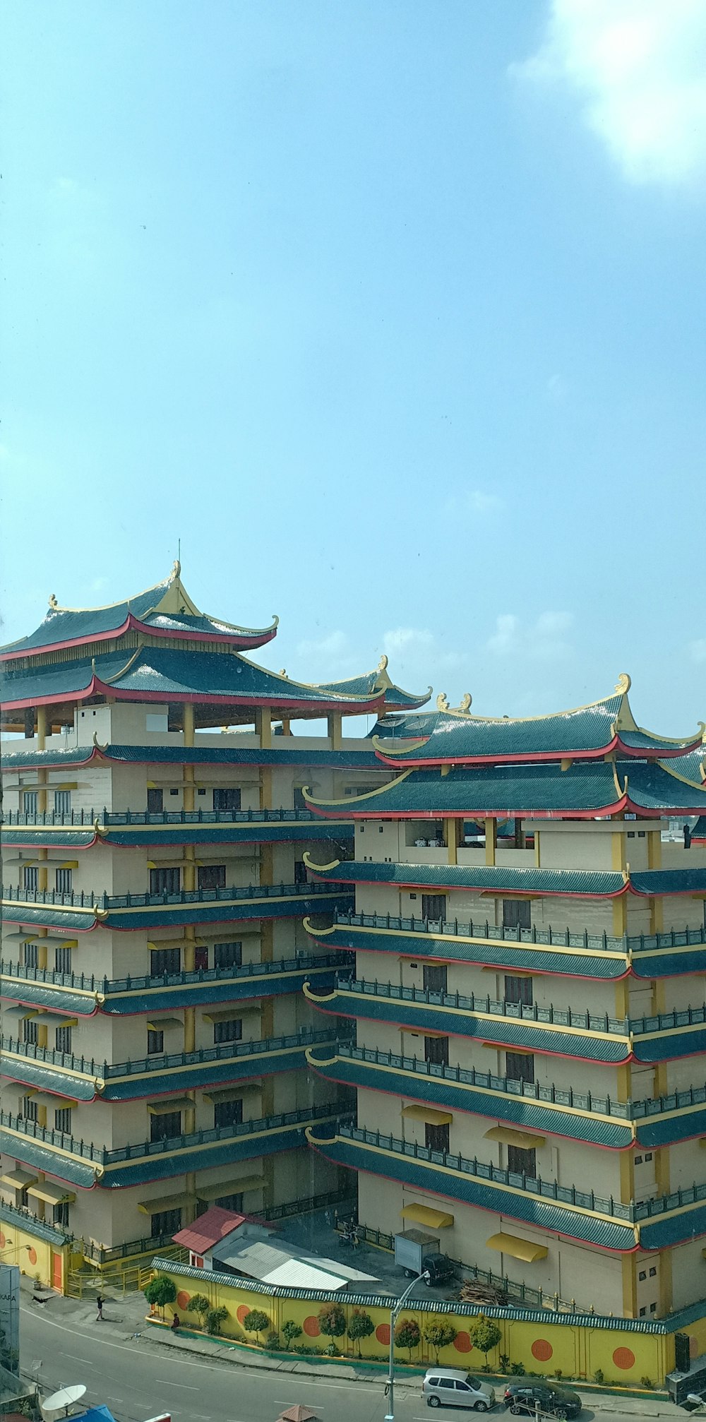 a large building with a lot of balconies on top of it
