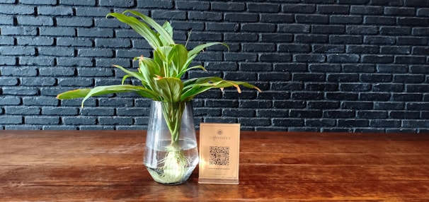 A vibrant floral arrangement with a QR code attached.