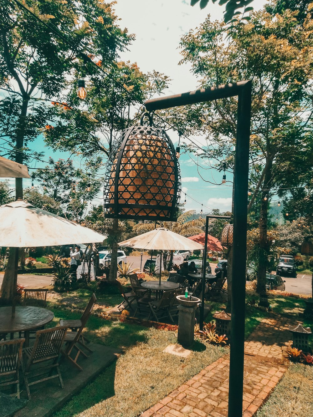 a large pineapple sitting on top of a lush green field