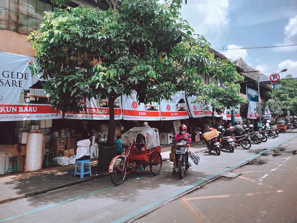 a group of people riding motorcycles down a street