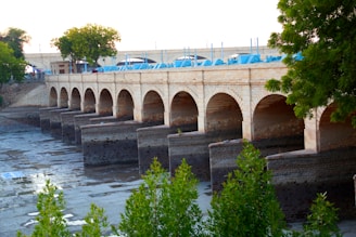 a bridge over a river with cars on it