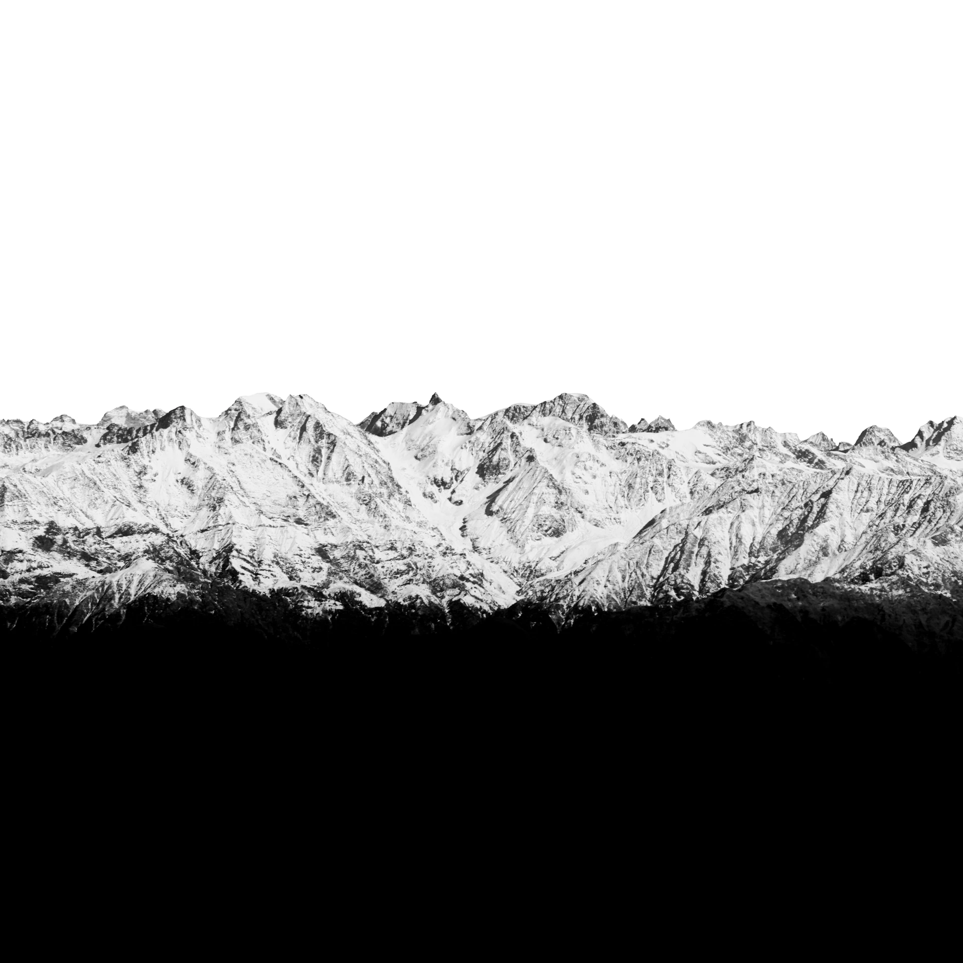a black and white photo of a mountain range