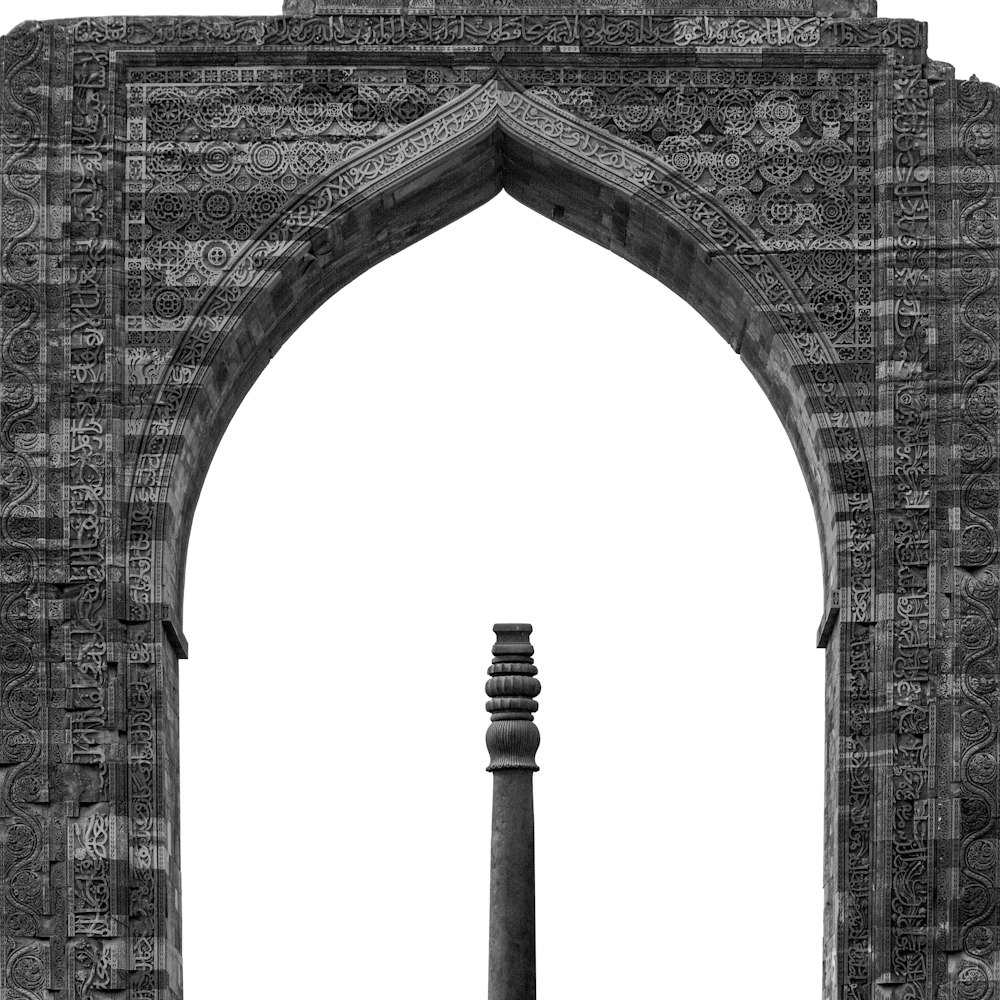 a black and white photo of an archway