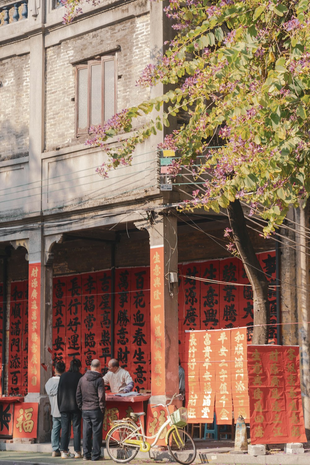 a group of people standing in front of a building