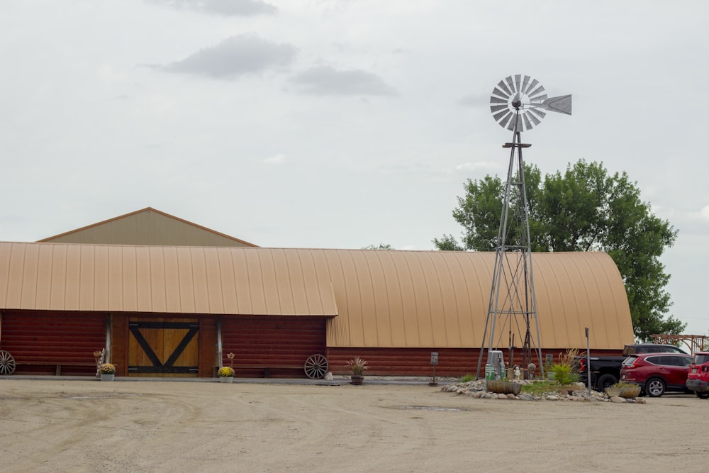 a red truck parked in front of a red barn