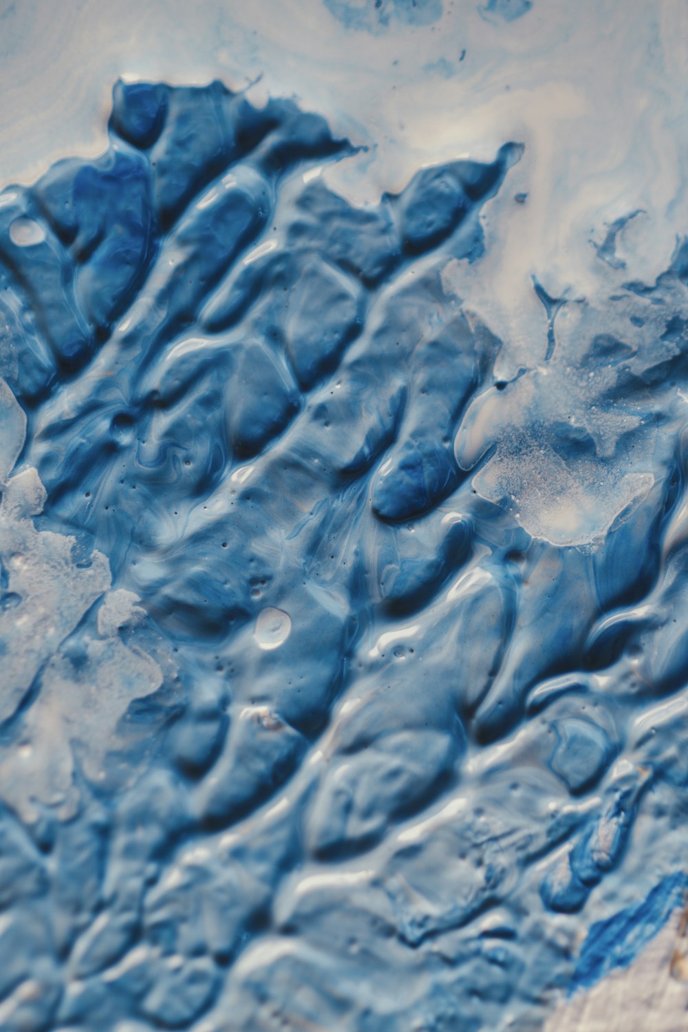 a close up of a blue and white surface