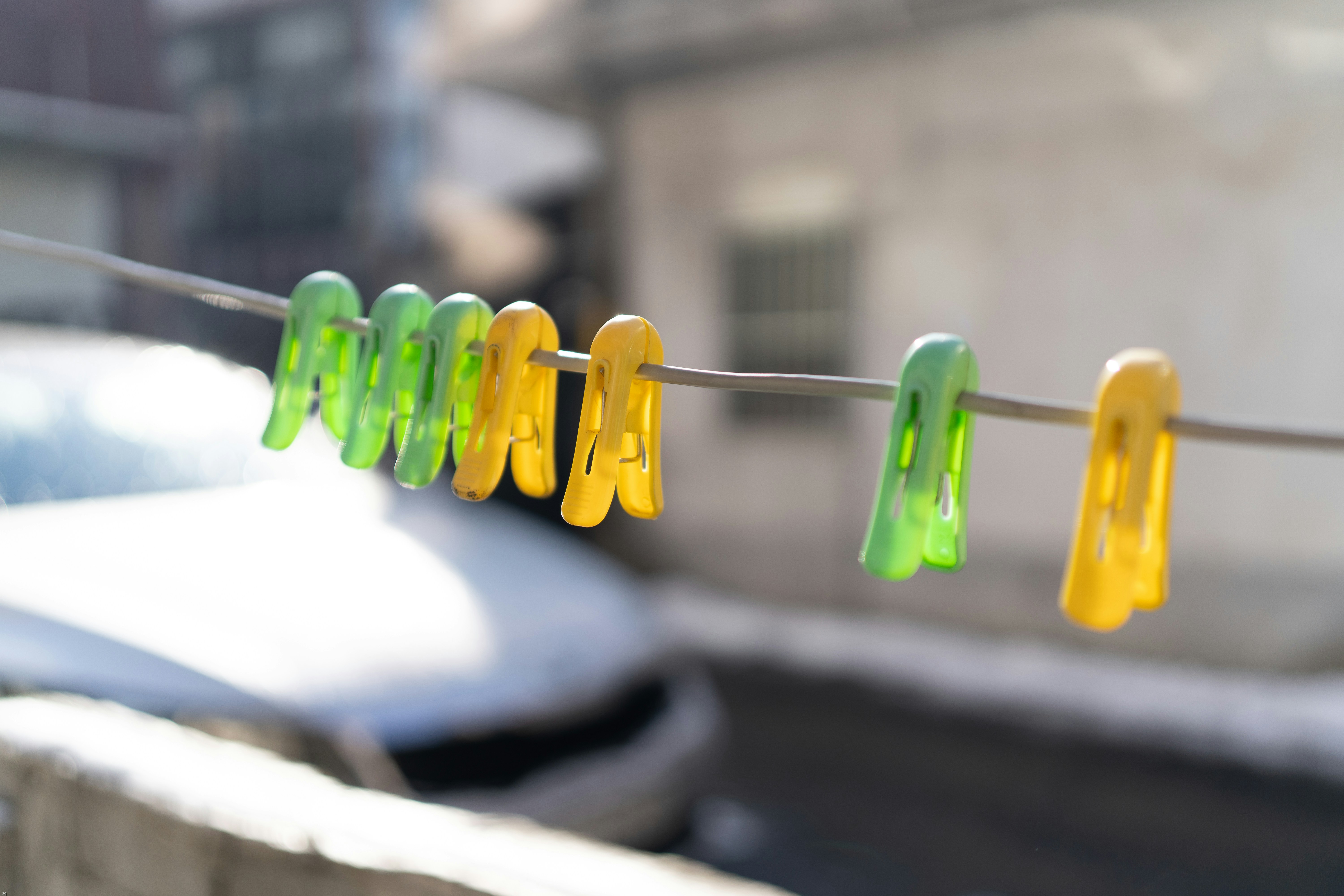 clothes pins are hanging on a clothes line