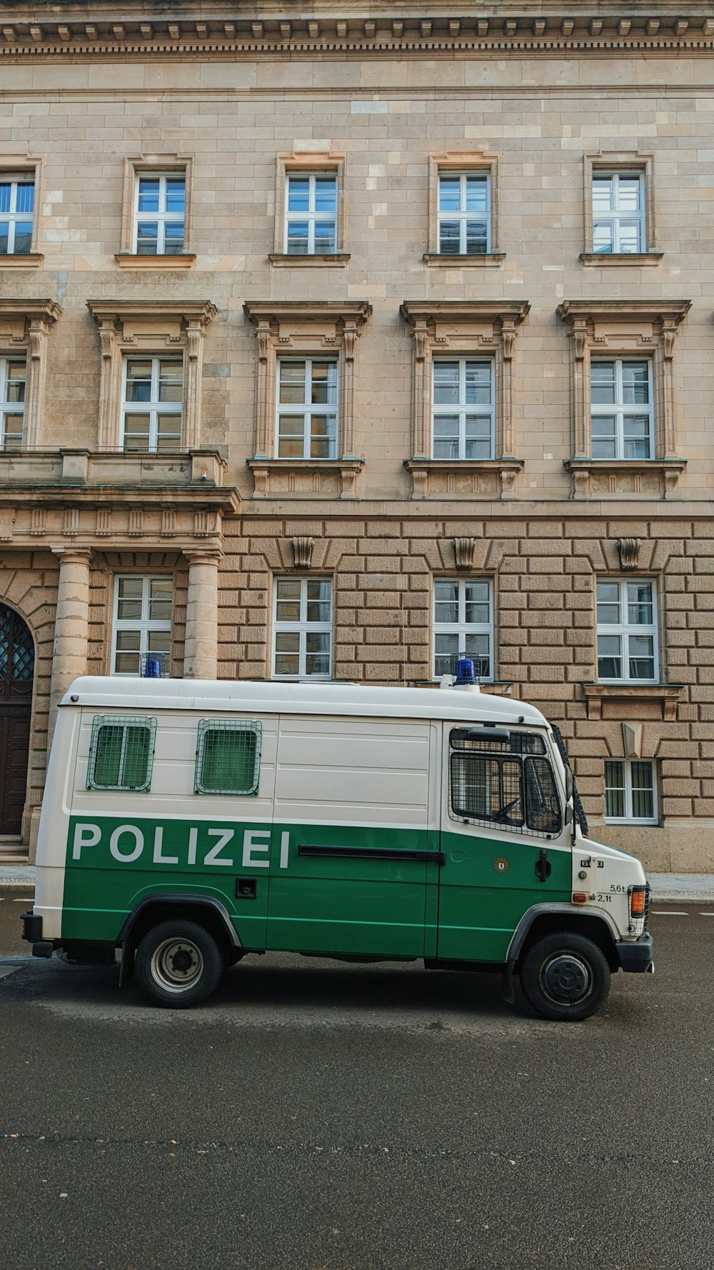 a police van parked in front of a building