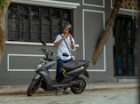 A local driver partner preparing his scooter for a group tour.