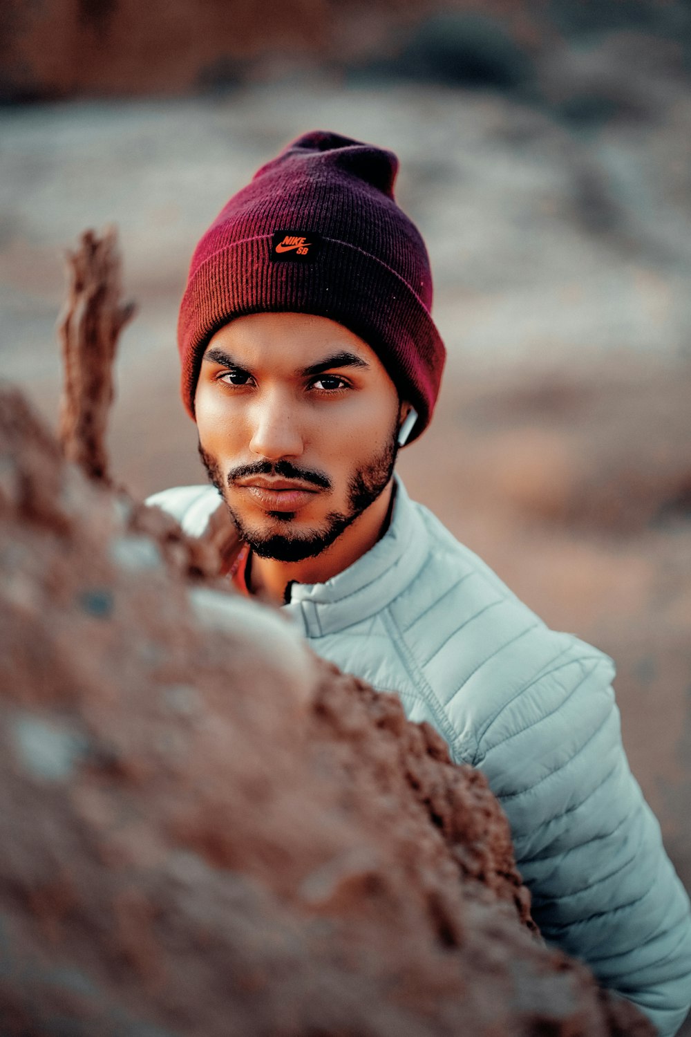 a man with a beard wearing a beanie