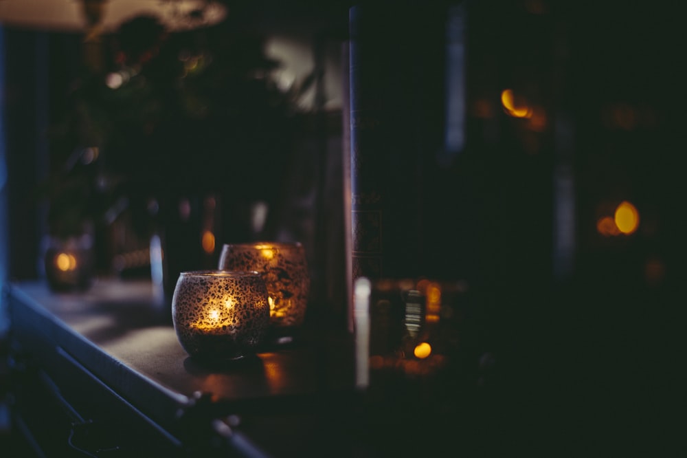 a couple of candles that are sitting on a table