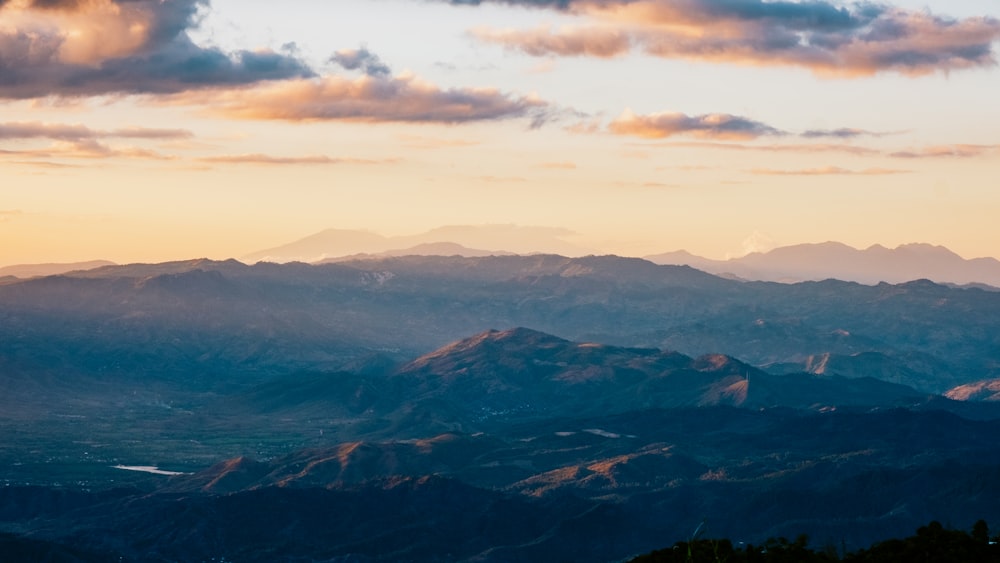 a view of a mountain range at sunset