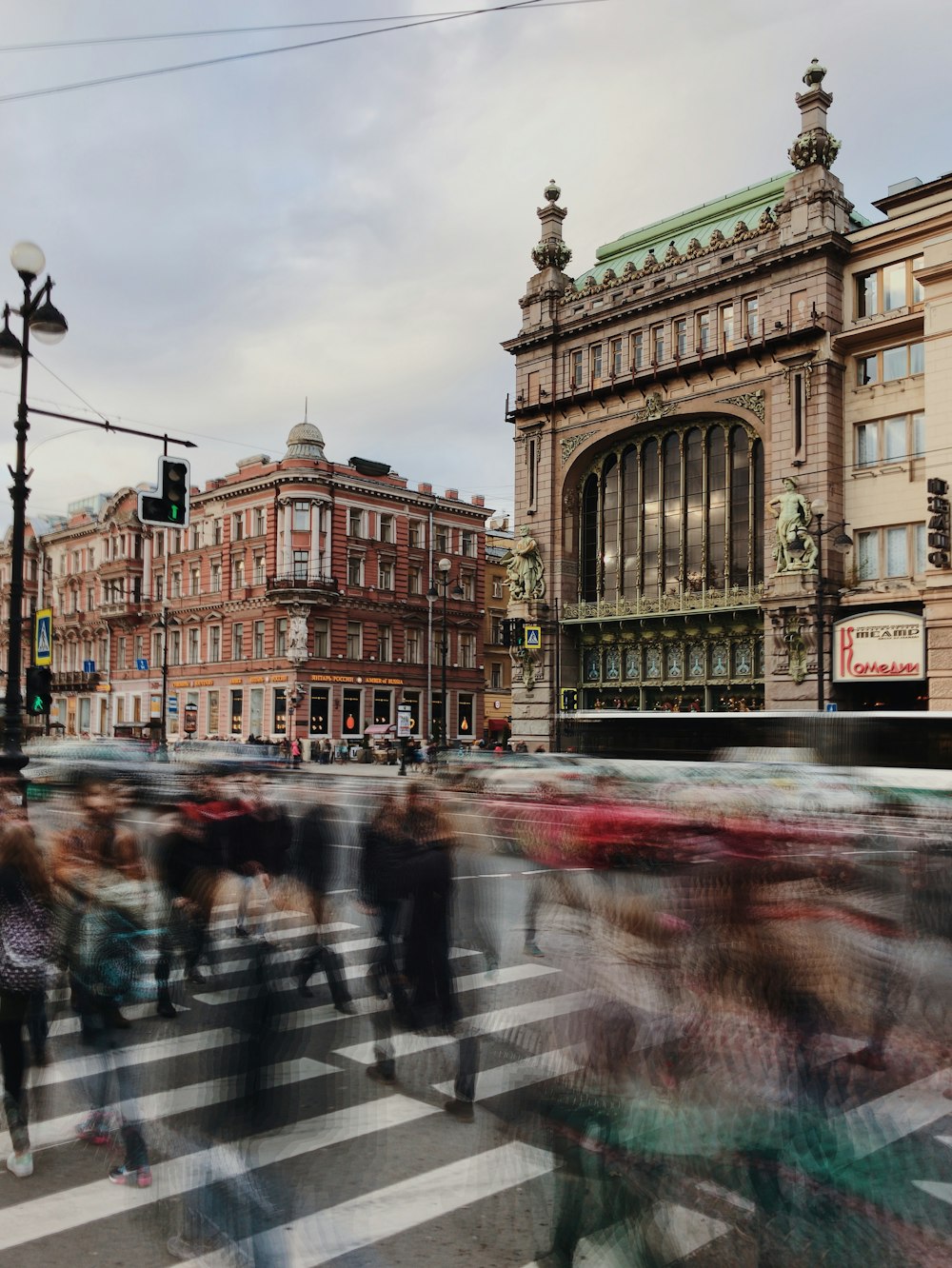 a blurry photo of people crossing a street