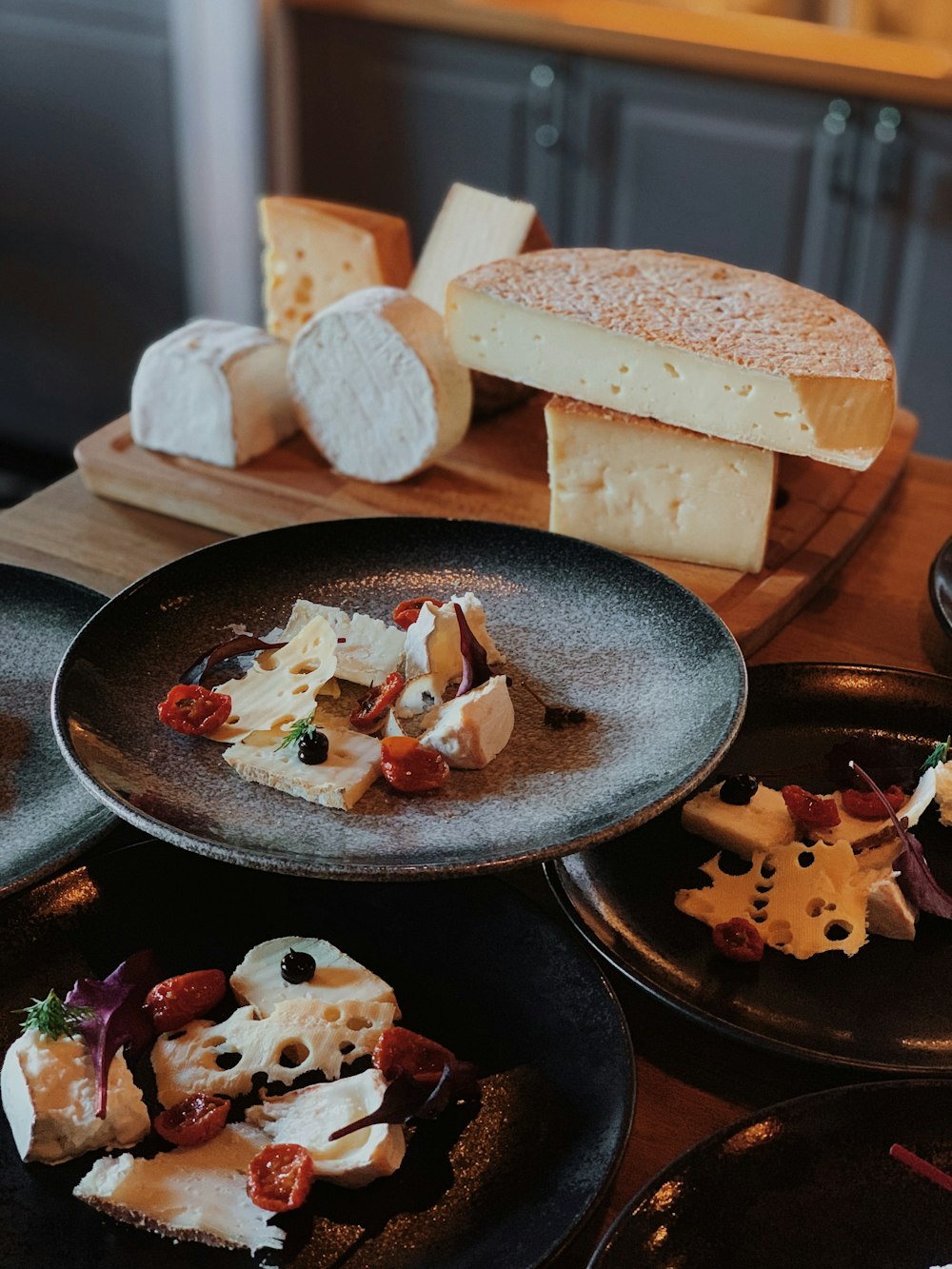 a wooden table topped with plates of food