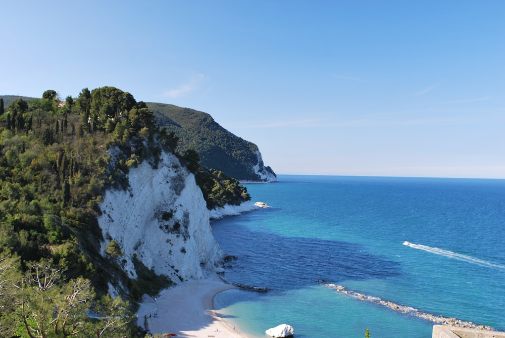 a view of a beach with a boat in the water