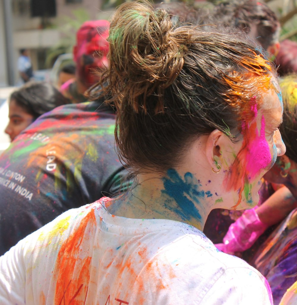 a group of people covered in colorful paint