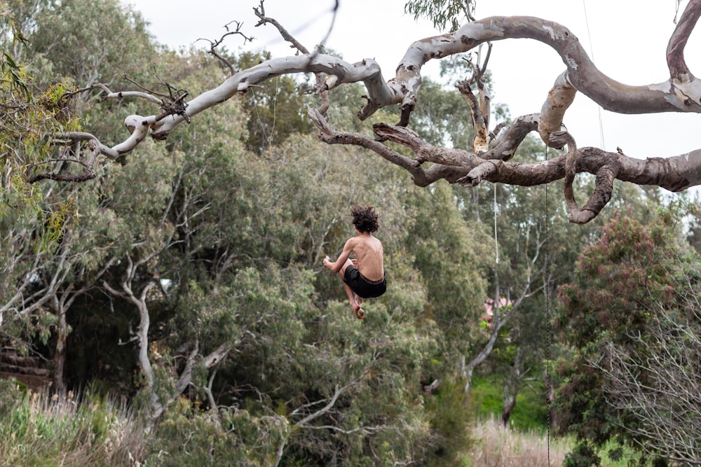 a person jumping off a cliff into the water