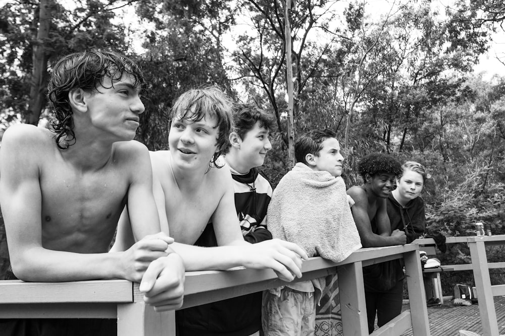 a group of young men standing next to each other