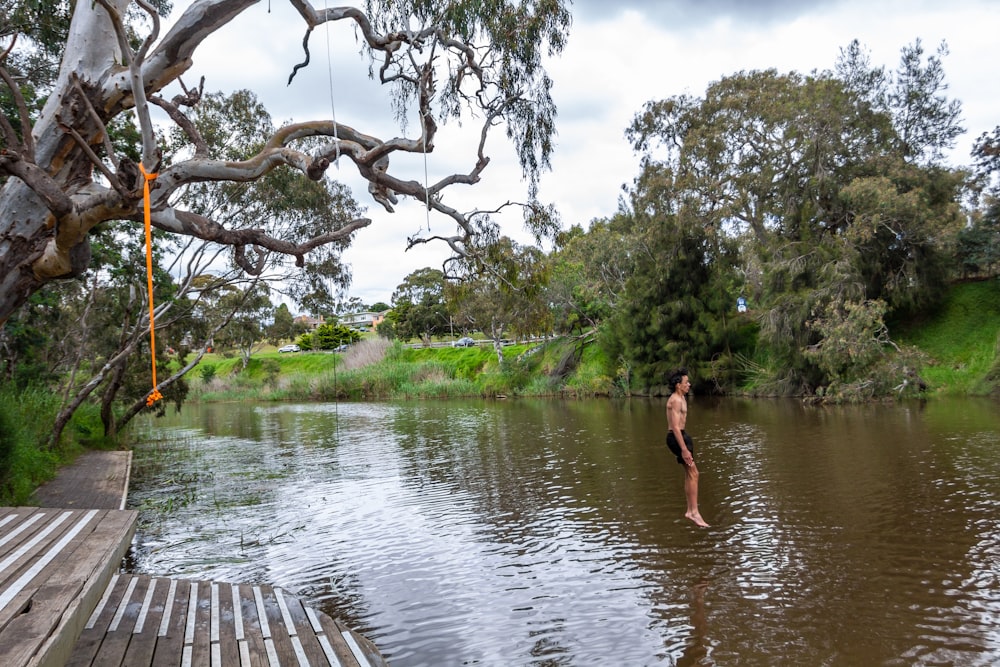 a man standing in the middle of a river