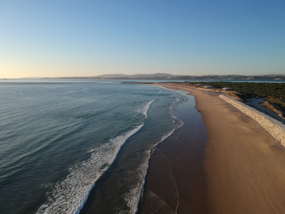 an aerial view of a beach and ocean