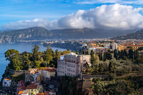 a scenic view of a city and a body of water