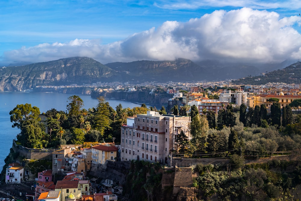 a scenic view of a city and a body of water