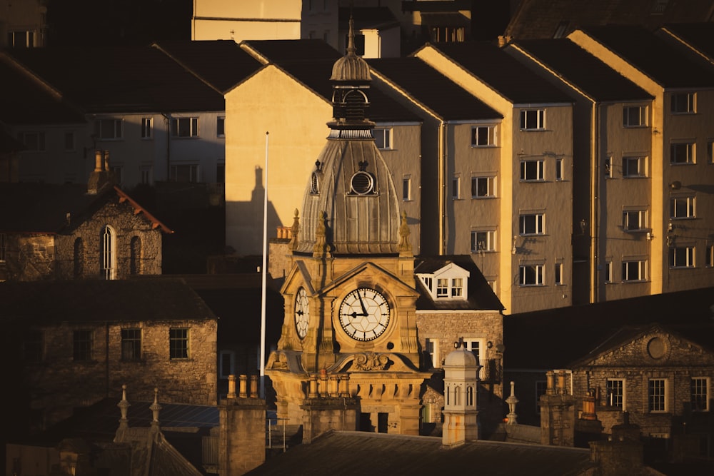 a clock tower in the middle of a city