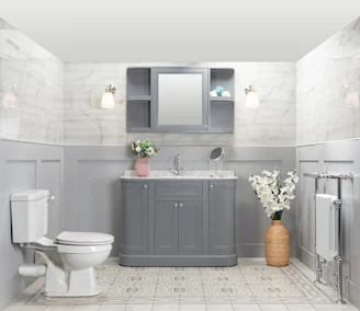 A cozy bathroom corner featuring a stylish vanity stool, a decorative mirror above, and a neatly arranged shower storage basket.