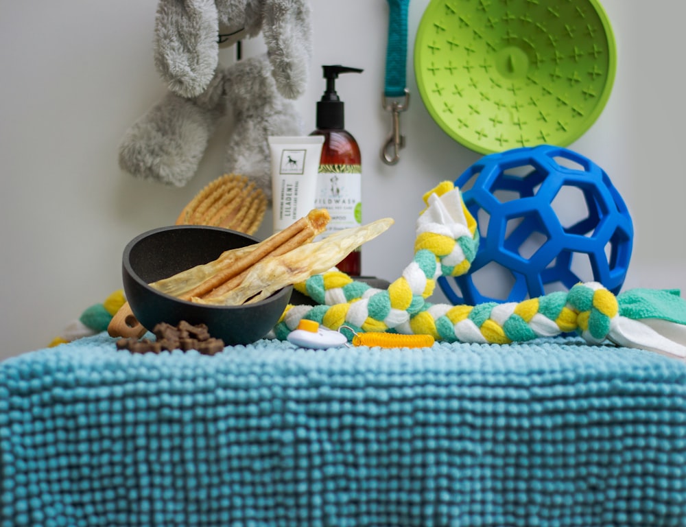 a table topped with a bowl of food and a bowl of crackers