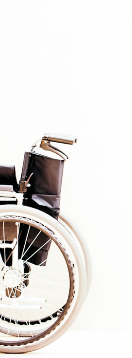 a wheelchair with wheels is shown against a white background