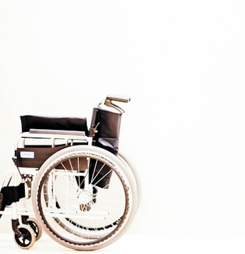 a wheelchair with wheels is shown against a white background