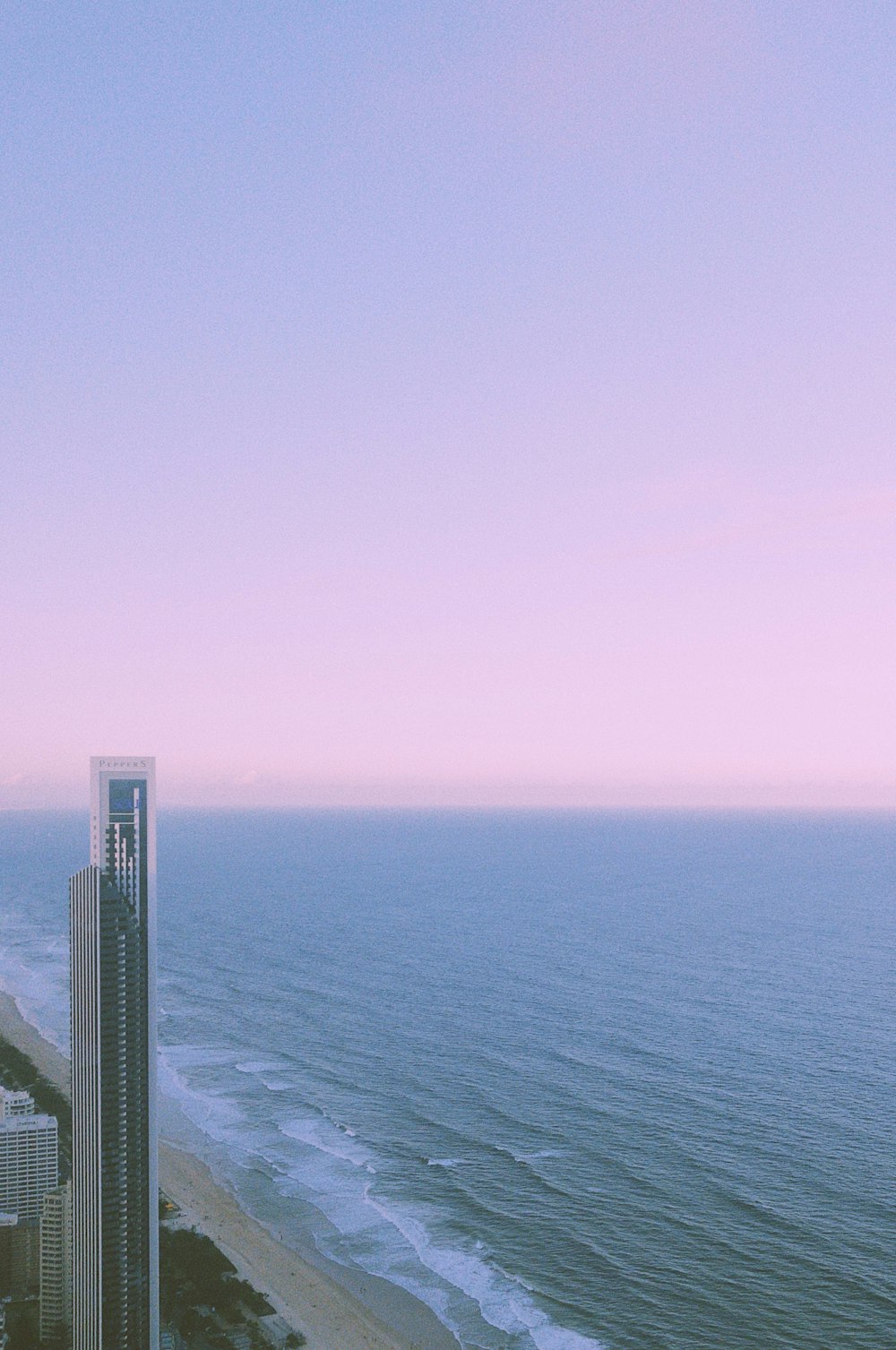 a view of the ocean from a high rise building