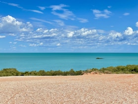 a view of a body of water from a hill