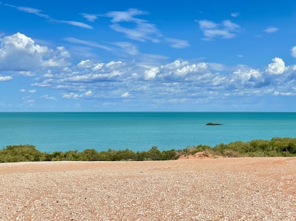 a view of a body of water from a hill